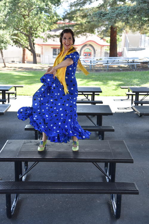 Danica Sena flamenco dancing on a picnic table